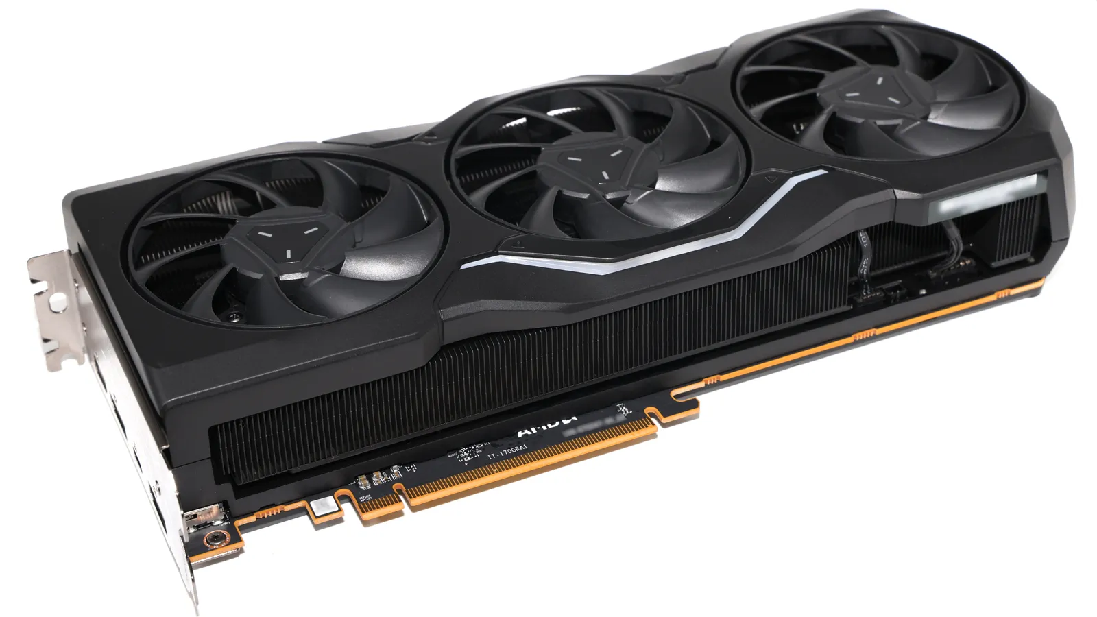 A Sapphire AMD Radeon RX 7900 XTX graphics card with three fans, shown on a white background.